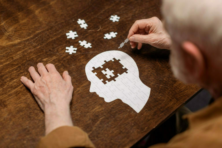 a person holding a paper with a design on it