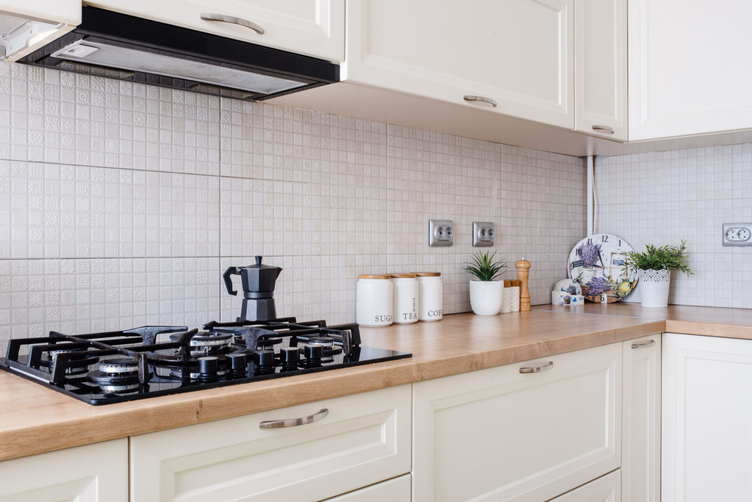 a kitchen with white cabinets