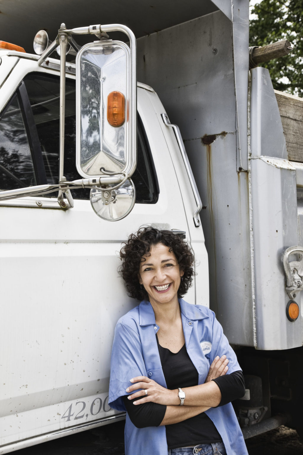 a person standing next to a truck