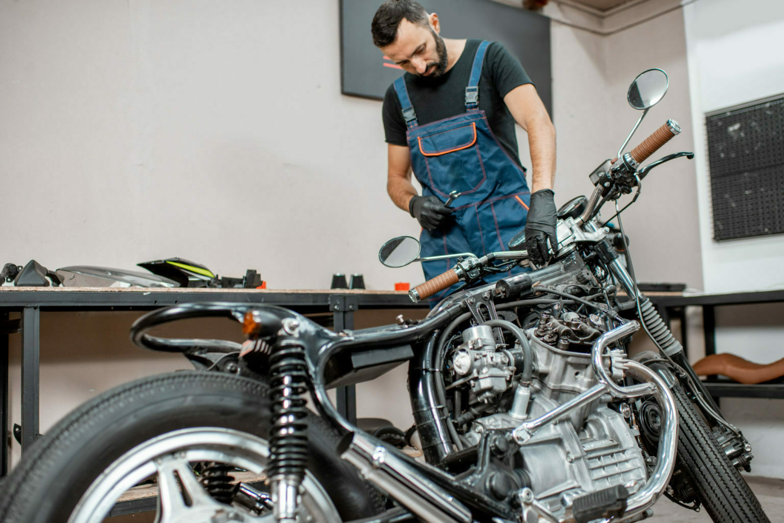 a person working on a motorcycle