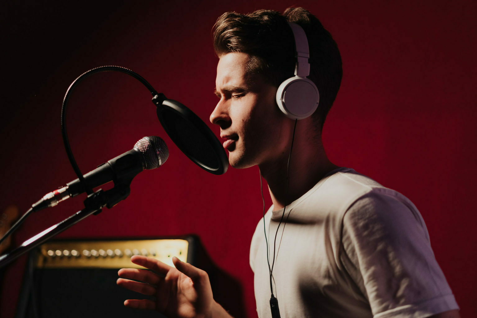 a man singing into a microphone