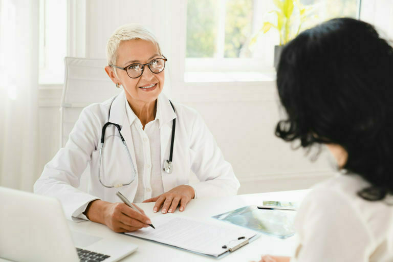 women talking to doctor